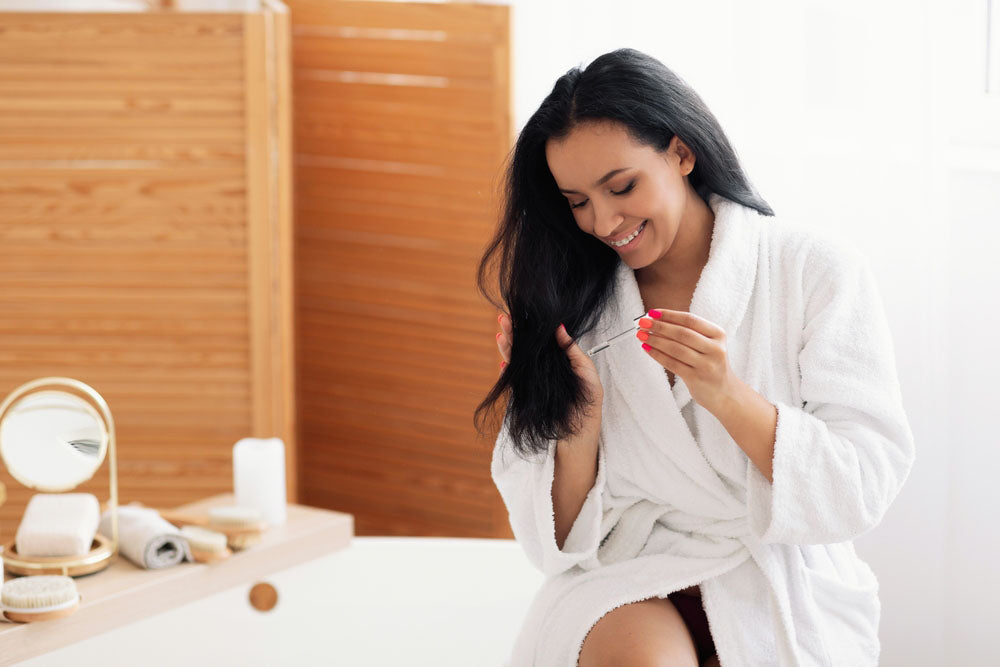 applying cosmetics in bathroom