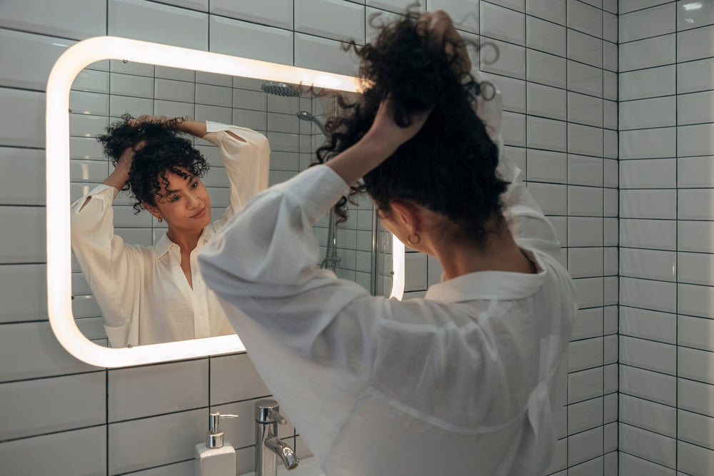 woman looking in the mirror